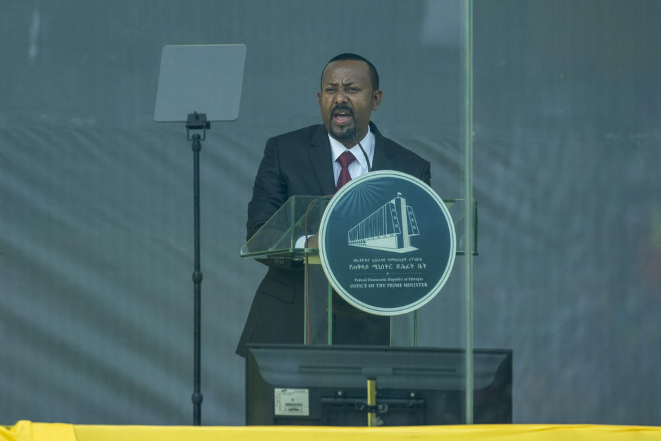 FILE - Ethiopia's Prime Minister Abiy Ahmed speaks behind bulletproof glass at his inauguration ceremony, after he was sworn in for a second five-year term, in the capital Addis Ababa, Ethiopia Monday, Oct. 4, 2021. Ethiopia's prime minister says he will lead his country's army "from the battlefront" beginning Tuesday, Nov. 23, 2021, a dramatic new step by the Nobel Peace Prize-winner in a devastating yearlong war. (AP Photo/Mulugeta Ayene, File)