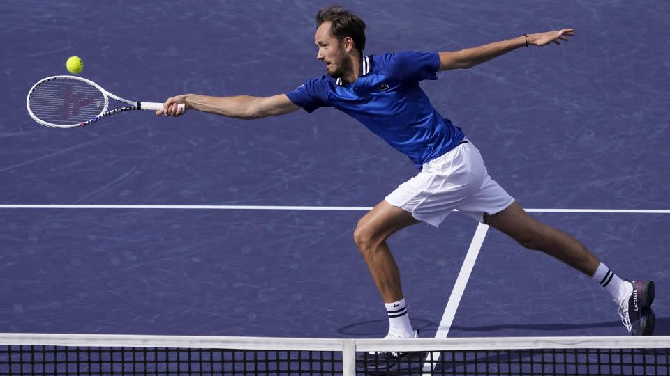 Medvedev reaches for a volley against Alcaraz. - Mark J. Terrill/AP
