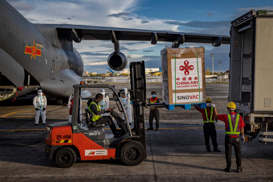 A crate containing Sinovac Biotech COVID-19 vaccines is loaded into a truck upon arriving at Ninoy Aquino International Airport on Feb. 28, 2021 in Manila. Sunday's delivery marks the first time the Philippines received official coronavirus vaccines, the last country in ASEAN to do so<span class="copyright">Ezra Acayan—Getty Images</span>