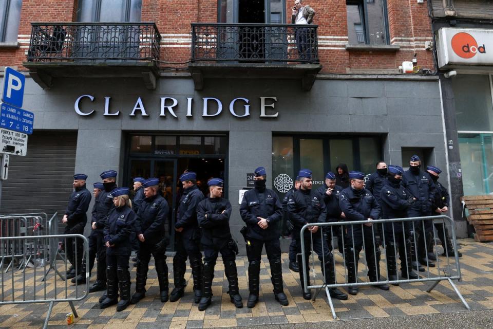 Police officers secure the area outside the venue (REUTERS)