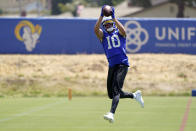 Los Angeles Rams wide receiver Cooper Kupp makes a catch at the NFL football team's practice facility, Thursday, May 26, 2022, in Thousand Oaks, Calif. (AP Photo/Marcio Jose Sanchez)