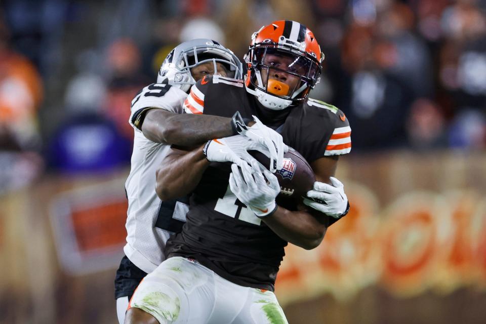 Cleveland Browns wide receiver Donovan Peoples-Jones (11) makes a catch under pressure from Las Vegas Raiders cornerback Casey Hayward (29) during the second half of an NFL football game, Monday, Dec. 20, 2021, in Cleveland. (AP Photo/Ron Schwane)