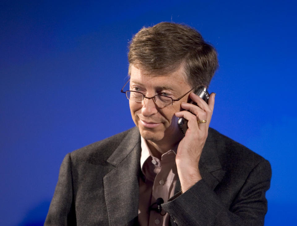 Microsoft Corporation Chairman and Chief Software Architect Bill Gates, holds a new Treo phone during a press conference to announce a strategic alliance to expand the smartphone market with a new line of Treo smartphones from Verizon Wireless. (Photo by Kim Kulish/Corbis via Getty Images)