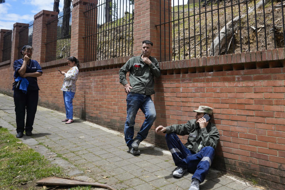 Residents gather outside their homes after a quake was felt in Bogota, Colombia, Thursday, Aug. 17, 2023. A magnitude 6.3 earthquake shook Colombia's capital and other major cities on Thursday, according to reports by United States Geological service. USGS reported a second 5.7 magnitude quake shortly after the first. (AP Photo/Ricardo Mazalan)