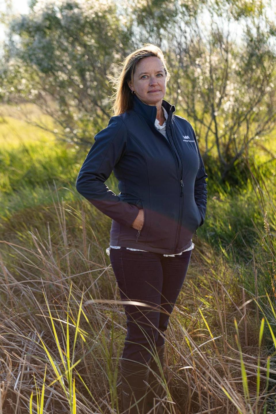 Dawn York, a senior coastal planner at the engineering firm Moffatt & Nichol, photographed in Wilmington, N.C., in November. York is working on plans for elevating the Battleship North Carolina’s parking lot and re-naturalizing the flooded portion into a marsh with a tidal creek that will absorb typical tidal floodwaters.