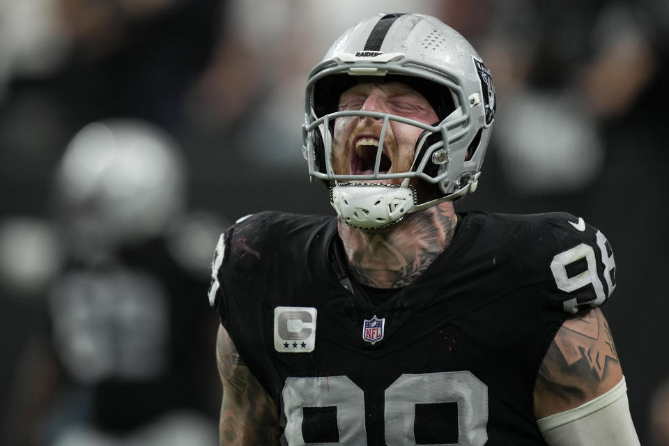 Las Vegas Raiders defensive end Maxx Crosby, right, celebrates his sack and safety during the second half of an NFL football game against the New England Patriots, Sunday, Oct. 15, 2023, in Las Vegas. The sack was split with teammate defensive tackle Bilal Nichols on the play. (AP Photo/John Locher)