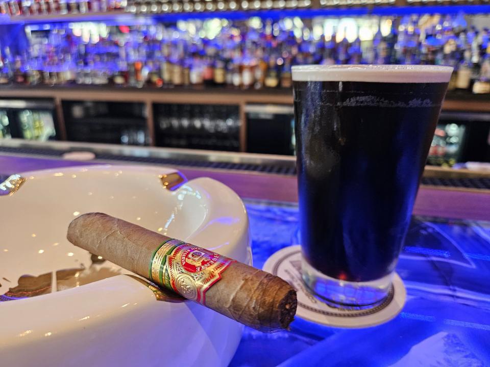 Arturo Fuente Chateau Fuente Natural cigar and a Guinness at Corona Cigar Company's new location in downtown Sarasota photographed on July 21, 2023.