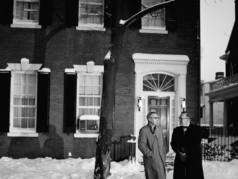 NBC News' Dave Garroway interviews Pat McMahon, whom John F. Kennedy saved in World War II, outside Kennedy's home at 3307 N Street in Georgetown.