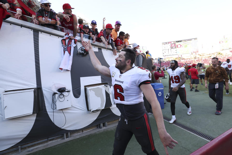 Tampa Bay Buccaneers quarterback Baker Mayfield (6) interacts with fans after the teams win against the Tennessee Titans following an NFL football game Sunday, Nov. 12, 2023, in Tampa, Fla. (AP Photo/Mark LoMoglio)