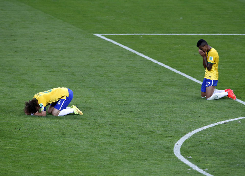 Brazil's David Luiz (L) and Luiz Gustavo react after losing their 2014 World Cup semi-finals against Germany at the Mineirao stadium in Belo Horizonte July 8, 2014. REUTERS/David Gray (BRAZIL  - Tags: SOCCER SPORT WORLD CUP)  