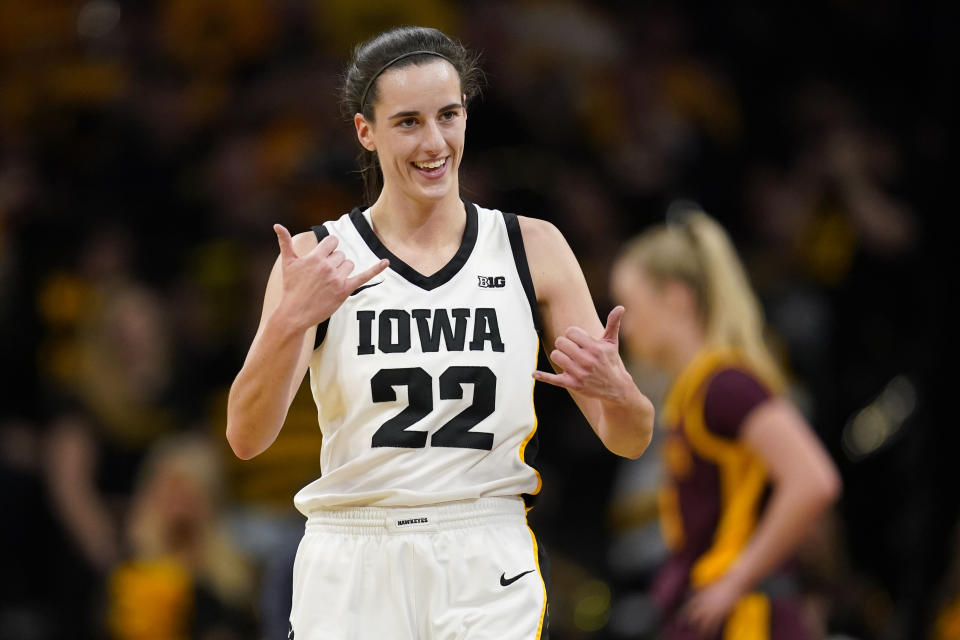 Iowa guard Caitlin Clark (22) celebrates during the first half of an NCAA college basketball game against Minnesota, Saturday, Dec. 30, 2023, in Iowa City, Iowa. (AP Photo/Charlie Neibergall)