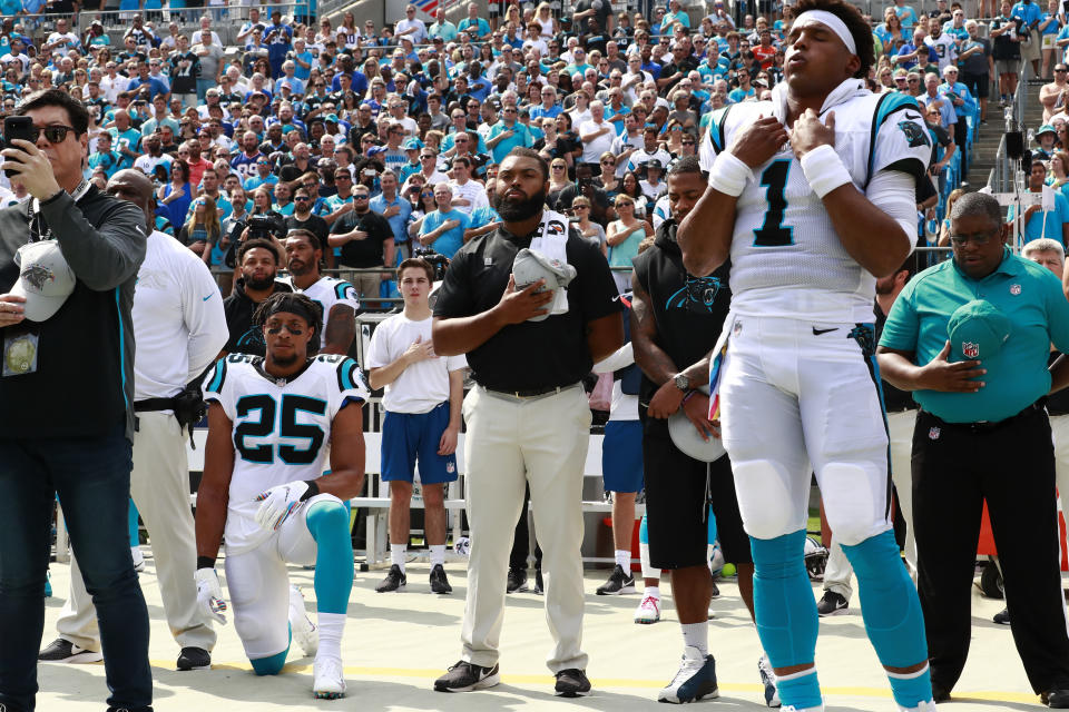 Carolina Panthers' Eric Reid (25) kneels as Cam Newton (1) stands during the national anthem before an NFL football game against the New York Giants in Charlotte, N.C., Sunday, Oct. 7, 2018. (AP Photo/Jason E. Miczek)
