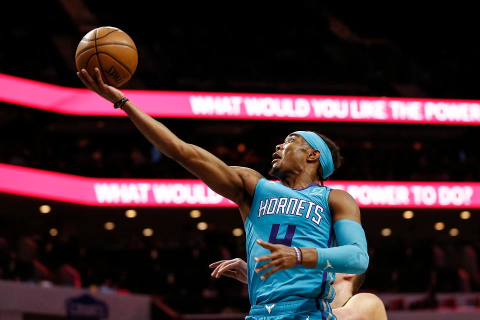 Charlotte Hornets guard Devonte' Graham drives to the basket against the Denver Nuggets during the first half of an NBA basketball game in Charlotte, N.C., Thursday, March 5, 2020. (AP Photo/Nell Redmond)