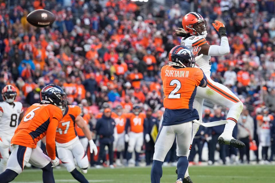 Cleveland Browns tight end David Njoku, right, is unable to catch a pass as Denver Broncos cornerback Pat Surtain II (2) defends Sunday in Denver.