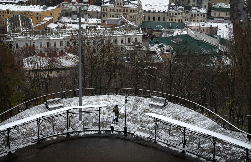 Snow covers the city centre (AP)