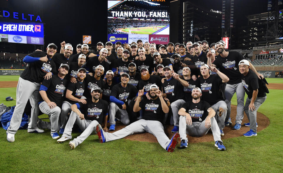 The Los Angeles Dodgers pose for a group portrait after an Game 4 of baseball's National League Division Series against the Atlanta Braves, Monday, Oct. 8, 2018, in Atlanta. The Los Angeles Dodgers won 6-2. (AP Photo/John Amis)