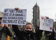 Hospitality workers protest in Parliament Square in London, Monday, Oct. 19, 2020. Hospitality workers are demonstrating outside Parliament against tougher coronavirus restrictions and the amount of financial support given by the government to the industry.(AP Photo/Frank Augstein)