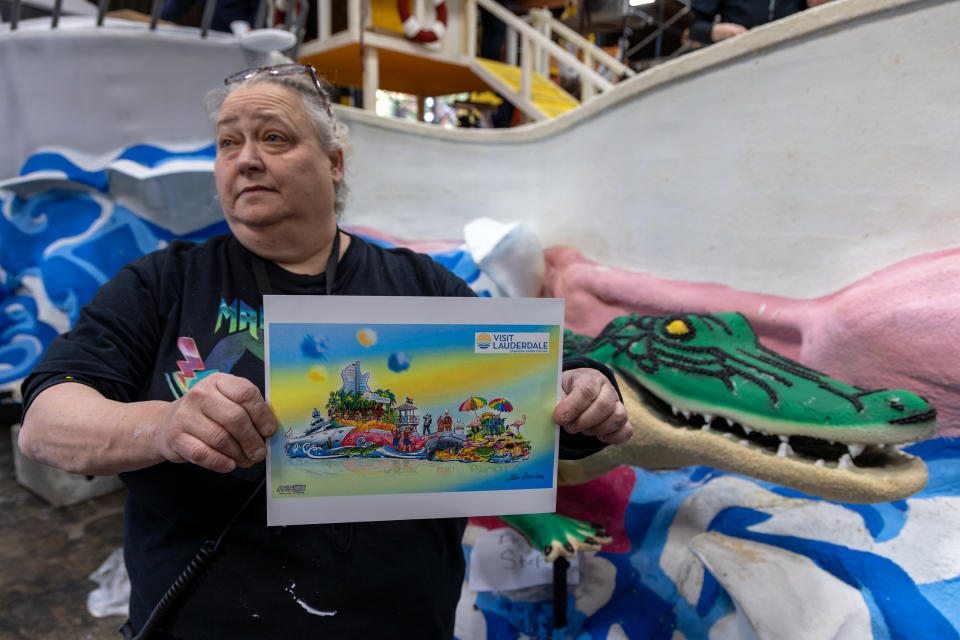 Nan Koupal-Smith, float leader, holds a rendering of Lauderdale float for Rose parade "Visit Lauderdale - Everyone Under The Sun"