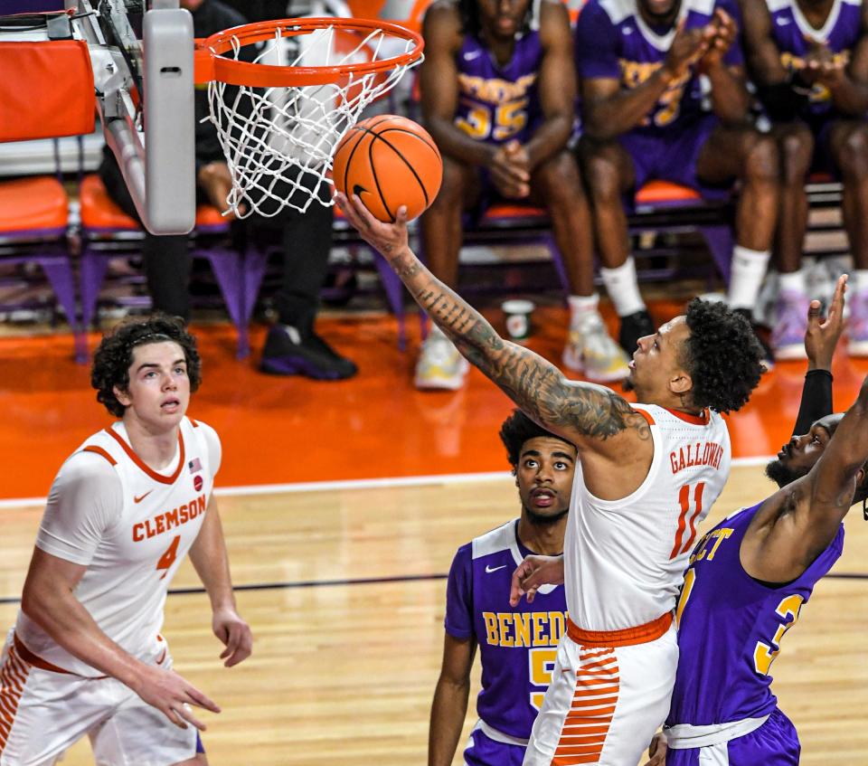 Clemson guard Brevin Galloway (11) scores near Benedict College forward Josh Linder (5) during the first half at Littlejohn Coliseum in Clemson, SC Wednesday, November 2, 2022. 