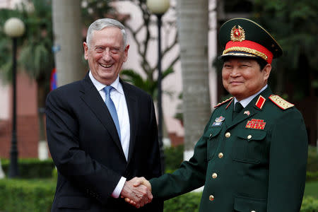 U.S. Secretary of Defense Jim Mattis (L) shakes hands with Vietnam's Defence Minister Ngo Xuan Lich during a welcoming ceremony in Hanoi, Vietnam January 25, 2018. REUTERS/Kham