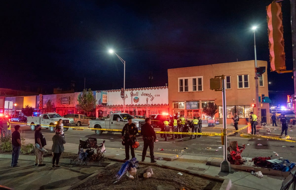 Police section off the site where an SUV came to an abrupt stop after a driver careened through the parade route of the Intertribal Ceremonial Centennial Celebration. in Gallup, New Mexico, Thursday, Aug. 4. 2022. (AP)