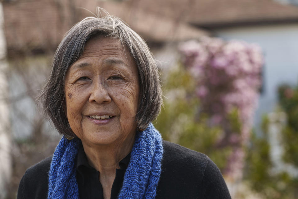 Kathy Masaoka poses for a picture outside her home in Los Angeles on Sunday, Feb. 12, 2023. When Japanese Americans fought in the 1980s for the U.S. government to apologize to the families it imprisoned during World War II, Black politicians and civil rights leaders were integral to the movement. Those advocates are now demanding atonement for Black Americans whose ancestors were enslaved. Masaoka, who testified in 1981 for Japanese American redress and in 2021 in favor of federal reparations legislation, says they are just beginning to educate their own community about Black history and anti-Black prejudice. (AP Photo/Damian Dovarganes)