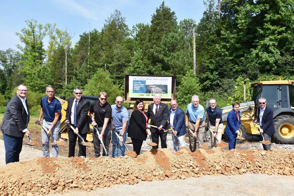 Breaking ground for the Environmental Management Disposal Facility last Wednesday is Steve Arnette, Mark Whitney, Wade Creswell; Brent Booker, Kevin Adkisson, Jeaneanne Gettle, Randy McNally, David Salyers; Ken Rueter, Jay Mullis; Chuck Fleischmann, and Ike White.