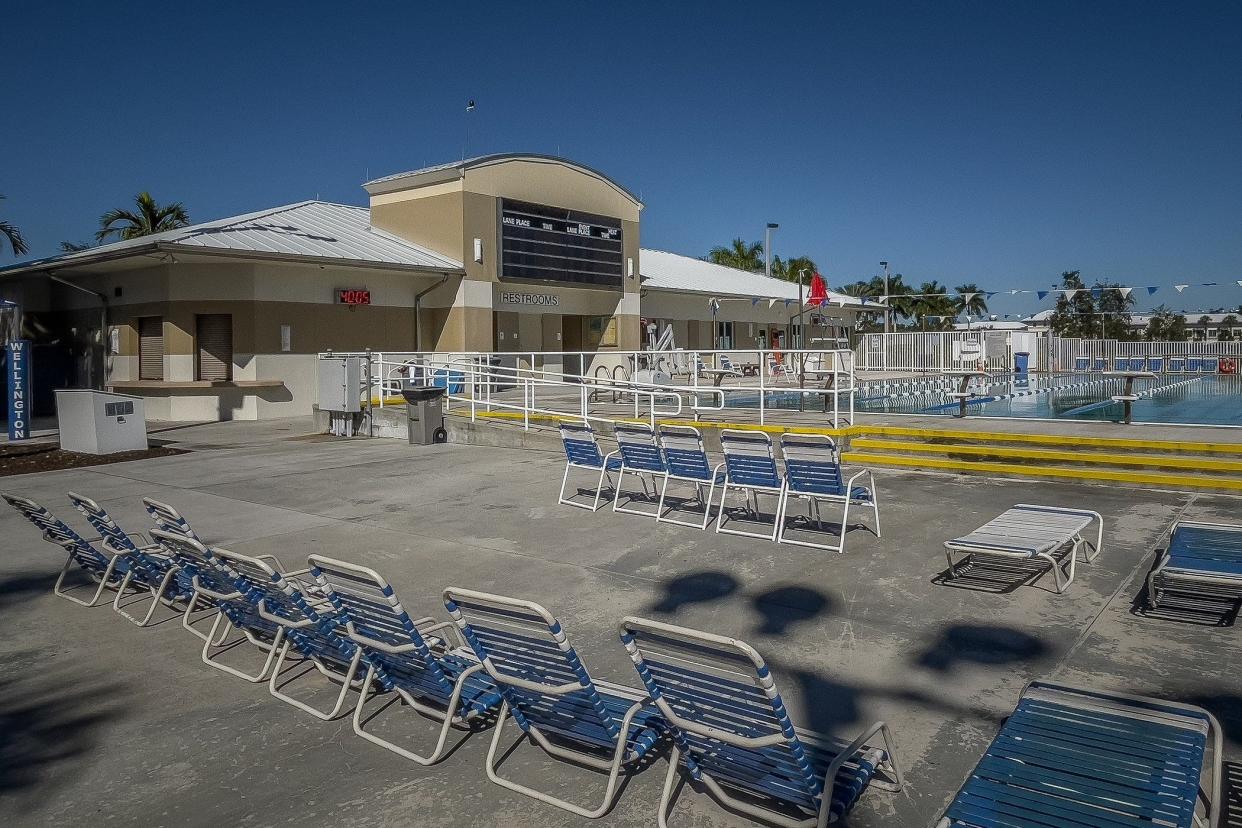 Lounge chairs are arranged on the deck at the Wellington Aquatic Center in Wellington, Fla., on January 11, 2022.