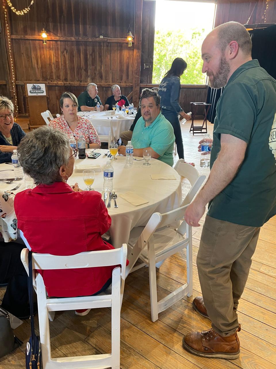 Old World Wisconsin Brewmaster Rob Novak talks with guests awaiting the next course at the first Pints and Plates of the season on May 26, 2023.