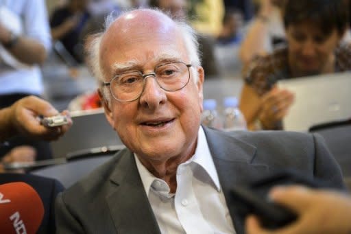 British physicist Peter Higgs smiles at a press conference on July 4, at the European Organization for Nuclear Research (CERN) offices in Meyrin near Geneva. After a quest spanning nearly half a century, physicists said on July 4 they had found a new sub-atomic particle consistent with the Higgs boson which is believed to confer mass