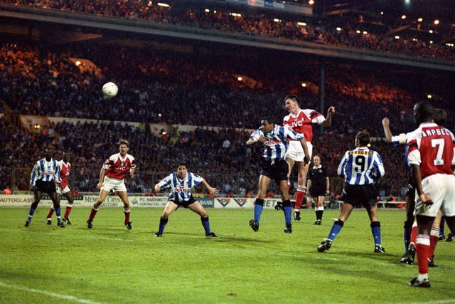 Andy Linighan heads Arsenal's extra-time winner against Sheffield Wednesday in 1993. It was the last time the FA Cup final was decided in a replay