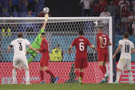 Turkey's goalkeeper Ugurcan Cakir makes a save against Italy's Giorgio Chiellini during the Euro 2020 soccer championship group A match between Italy and Turkey at the Olympic stadium in Rome, Friday, June 11, 2021. (Alberto Lingria/Pool Photo via AP)