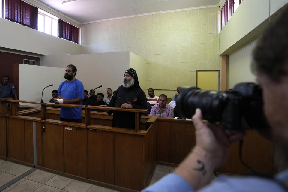 Two suspects appearing at the magistrate court in Cullinan, a town east of Pretoria, South Africa, Thursday, March 14, 2024. Suspects appeared at the court for the murder of three Egyptian monks belonging to the Coptic Orthodox Church at a monastery in South Africa. (AP Photo/Themba Hadebe)