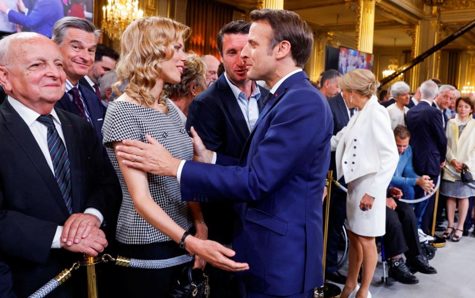 Emmanuel Macron greets his stepdaughter Tiphane Auzière after his swearing in for a second term in 2022