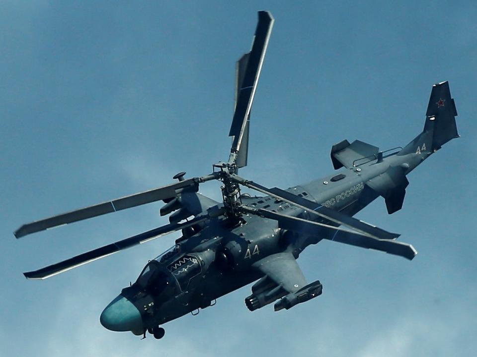 Kamov Ka-52 Alligator military helicopter performs during International Army Games 2016 in Dubrovichi outside Ryazan