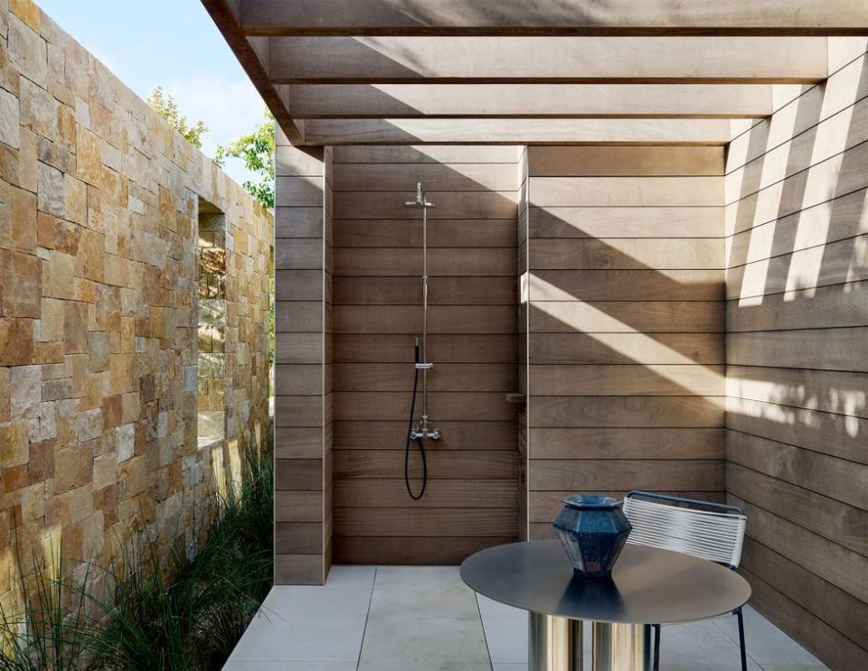 a patio with a table and chairs