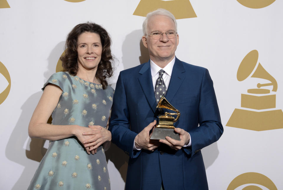 Edie Brickell, left, and Steve Martin pose in the press room with the award for best American roots song, "Love Has Come For You," at the 56th annual Grammy Awards at Staples Center on Sunday, Jan. 26, 2014, in Los Angeles. (Photo by Dan Steinberg/Invision/AP)