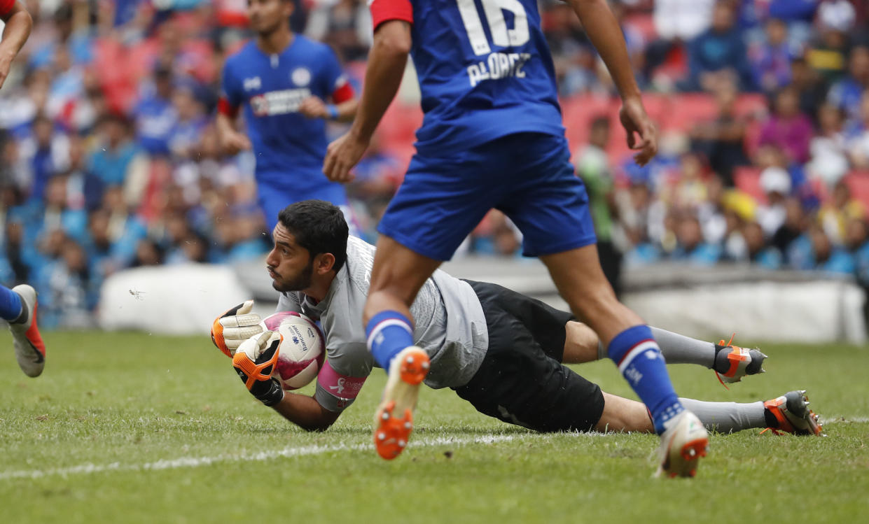 Cruz Azul's goalkeeper Jesus Corona catches the ball during a Mexico soccer league match against Monterrey during a Mexico soccer league match in Mexico City, Saturday, Oct. 6, 2018. (AP Photo/Eduardo Verdugo)