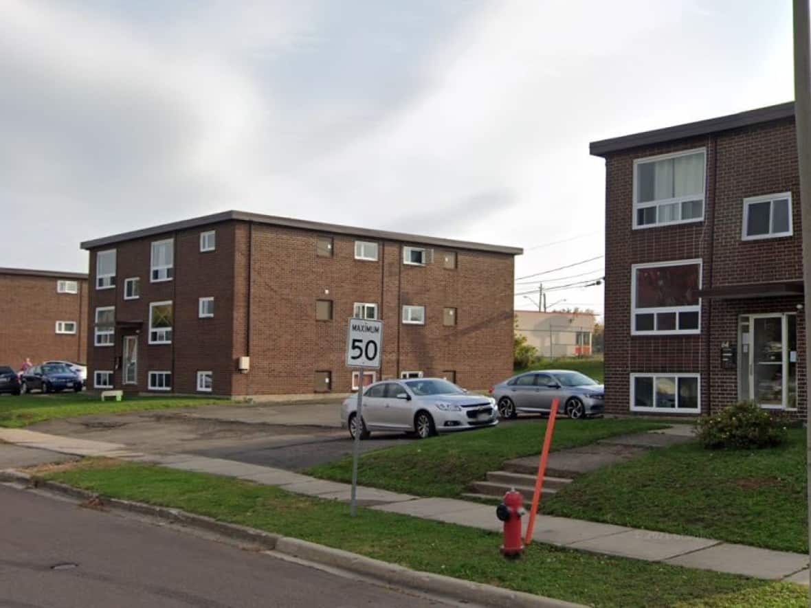 The lease document for these three apartment buildings on Savoie Drive in Moncton prohibits residents from helping homeless people around the property. (Google Street View - image credit)