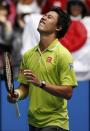 Kei Nishikori of Japan celebrates after defeating Ivan Dodig of Croatia in their men's singles second round match at the Australian Open 2015 tennis tournament in Melbourne January 22, 2015. REUTERS/Thomas Peter (AUSTRALIA - Tags: SPORT TENNIS)