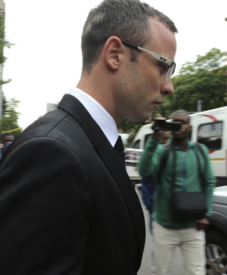 Oscar Pistorius leaves the high court in Pretoria, South Africa, Friday, March 28, 2014. The murder trial of Pistorius has been delayed until April 7 because one of the legal experts who will assist the judge in reaching a verdict is sick, the judge said Friday. Pistorius is charged with murder for the shooting death of his girlfriend, Reeva Steenkamp, on Valentines Day in 2013. (AP Photo/Themba Hadebe)