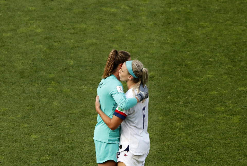 United States goalkeeper Alyssa Naeher, left, and Julie Ertz celebrate at the end of the Women's World Cup round of 16 soccer match between Spain and United States at Stade Auguste-Delaune in Reims, France, Monday, June 24, 2019. (AP Photo/Thibault Camus)