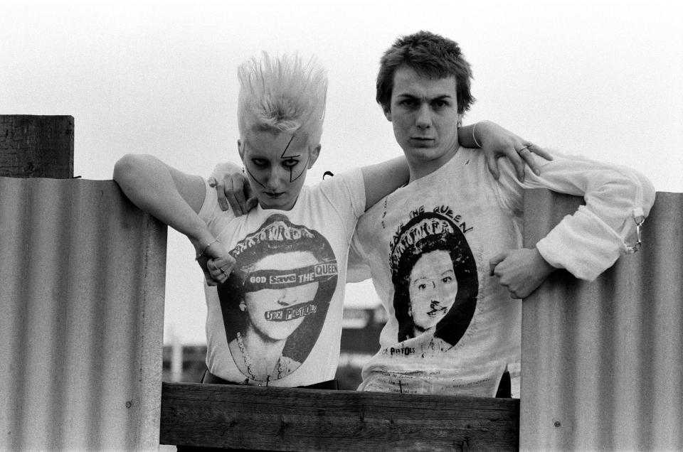 Pamela Rooke, aka Jordan, and Simon Barker, aka Six, modelling Sex Pistols 'God Save The Queen' T-shirts - Mirrorpix via Getty Images