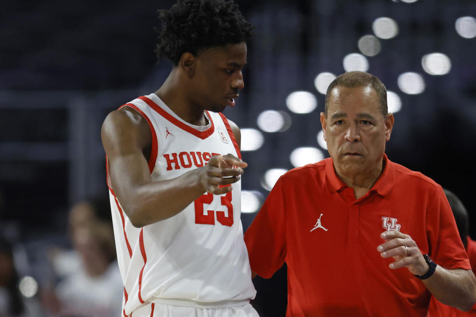 Houston head coach Kelvin Sampson listens to his guard Terrance Arceneaux (23) as Houston plays East Carolina during the second half of an NCAA college basketball game in the quarterfinals of the American Athletic Conference Tournament, Friday, March 10, 2023, in Fort Worth, Texas. Houston won 60-46. (AP Photo/Ron Jenkins)