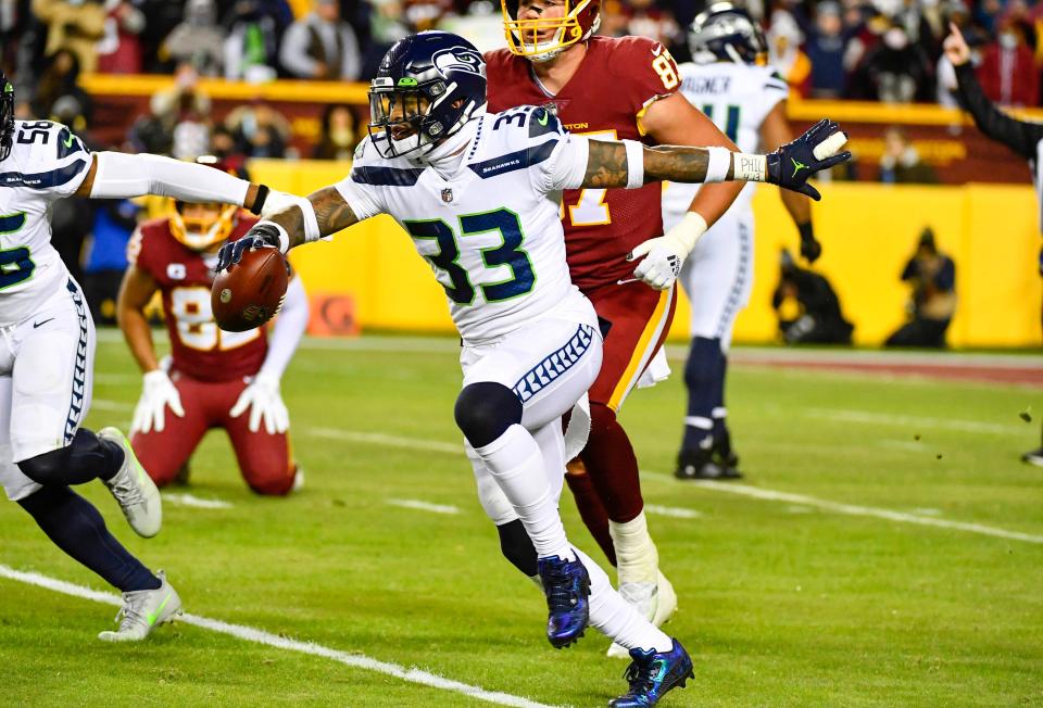 Seattle Seahawks safety Jamal Adams (33) reacts after recording an interception against the Washington Football Team during the first half at FedExField.