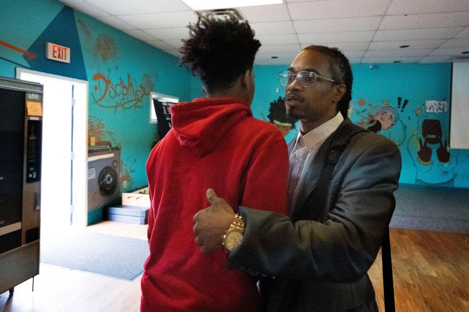 Daniel Mallory, 43, says goodbye to Devon, 15, after a discussion Wednesday, June 8, 2022, at VOICES in Indianapolis. Mallory is being celebrated as someone who's a father figure for multiple young people in the community. He talked to Devon about overcoming challenges and his plans for the future.