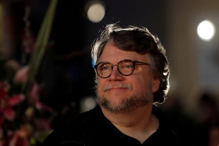 FILE PHOTO: Mexican director Guillermo del Toro poses during a photocall before the ceremony of honouring him with Malaga-Sur award for lifetime achievements during the 21st Festival de Malaga Cine Espanol (Malaga Spanish Film Festival) outside the Cervantes Theatre in Malaga, southern Spain, April 14, 2018. REUTERS/Jon Nazca/File Photo