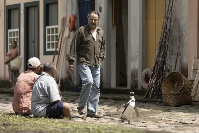 Joao (Jean Reno) rescues a penguin from an oil spill. Photo courtesy of Roadside Attractions