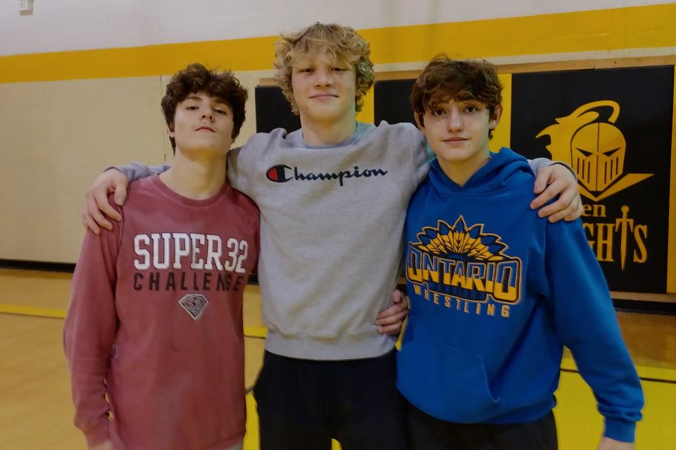 Ontario sophomore Mason Turnbaugh, a returning Mid-Ohio Athletic Conference champ, is flanked by brothers Jacob (left) and Aiden Ohl. Jacob, a junior, is a projected state champ and Aiden is ranked No. 6 in the state as a freshman.