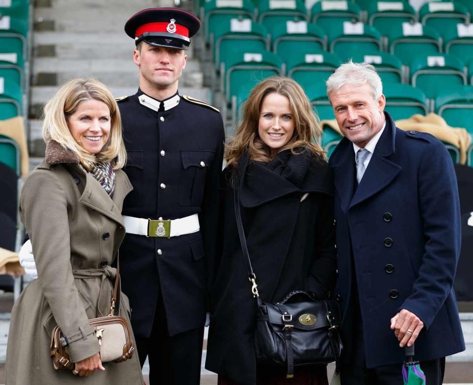 Kim Murray and her brother Junior Under Officer Scott Sears pose for a photographer with their parents Leonore Sears (l) and Nigel Sears (r) after Scott took part in the Sovereign's Parade at the Royal Military Academy Sandhurst on December 11, 2015 in Camberley, England